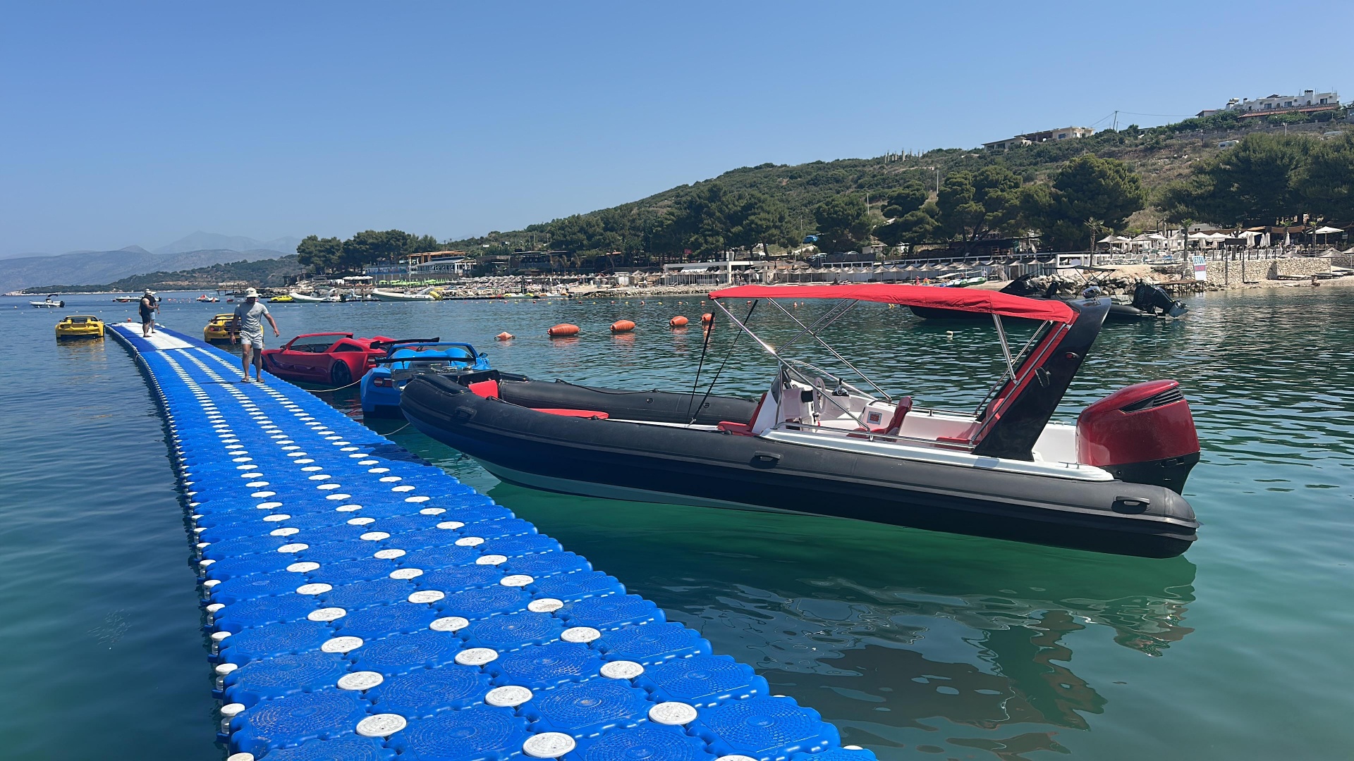 Speedboat and jet cars at the Poda dock