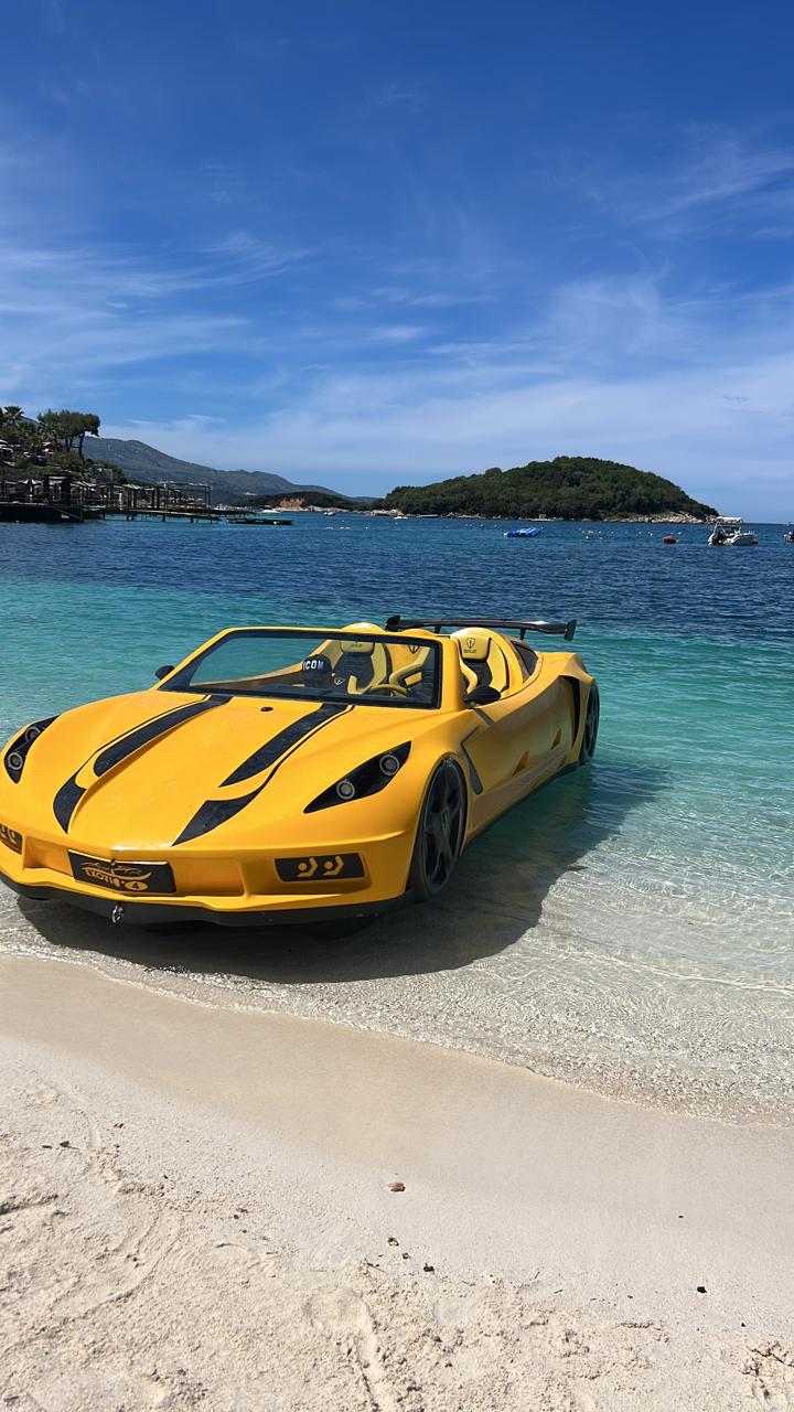 Yellow jet car parked on a Ksamil beach